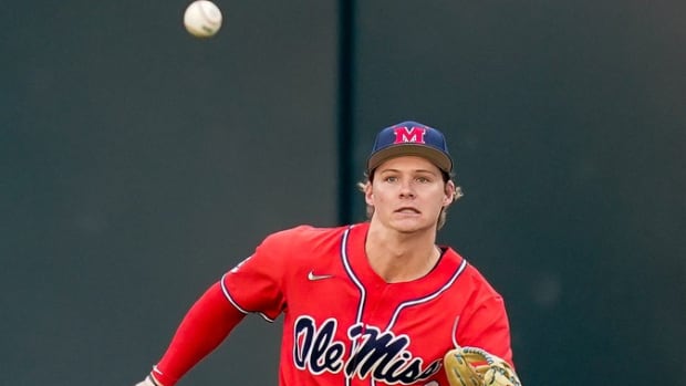 Ole Miss catcher Will Plattner (16) fields a single hit by Vanderbilt third baseman Davis Diaz by during the first inning at Hawkins Field in Nashville, Tenn., Thursday, March 16, 2023.